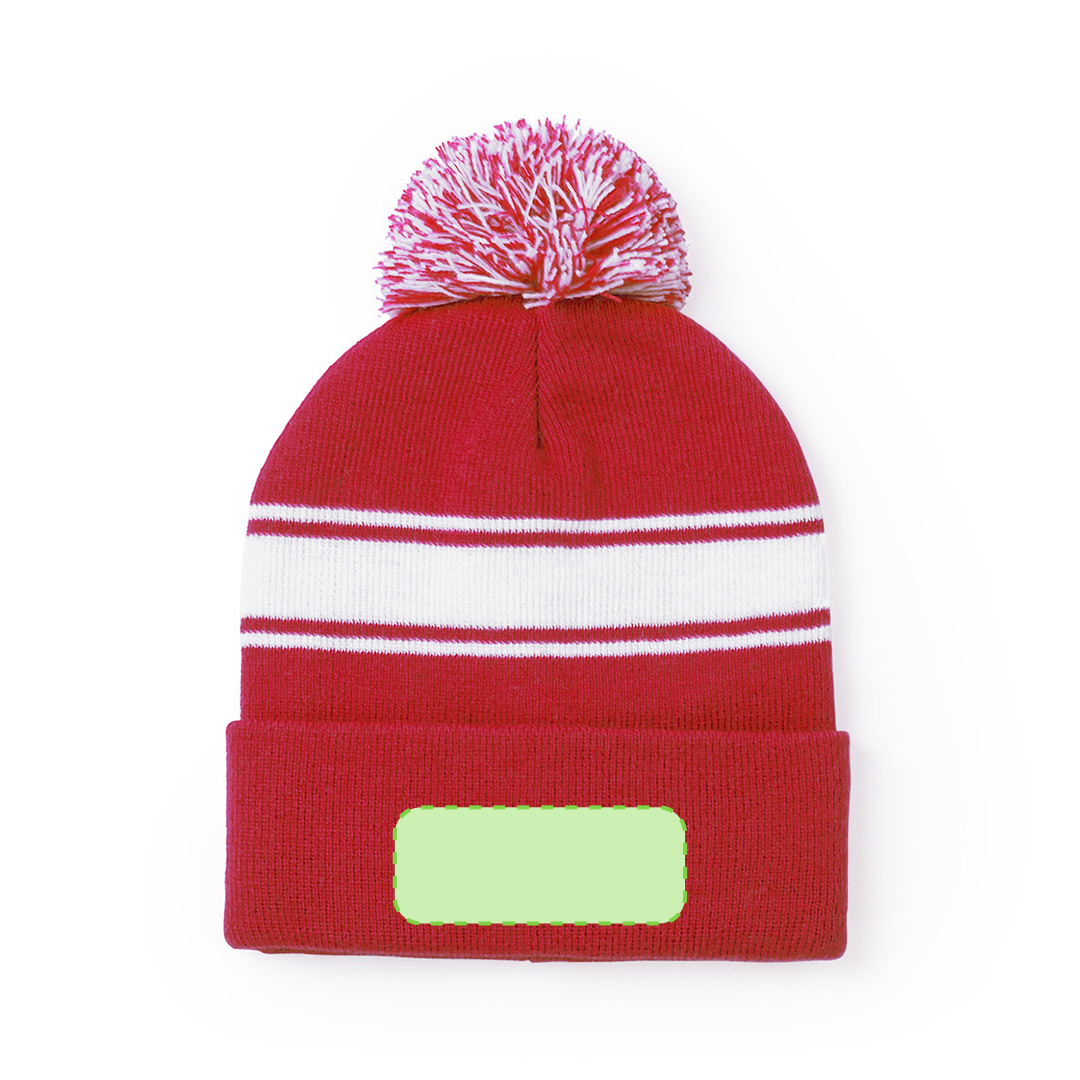 Gorro de acrílico con tira frontal blanca y pom pom bicolor a juego — el diseño más diferenciado del catálogo
