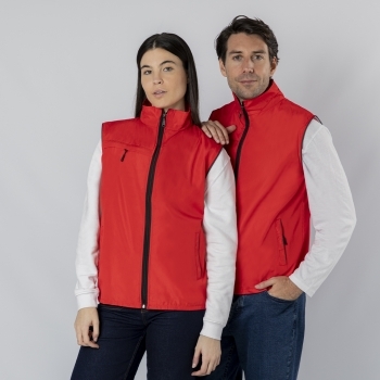 Chaleco Dervik adulto ligero transpirable — 100% poliéster 120 g/m², interior malla, bolsillo pecho + 2 laterales cremallera negra, media luna en cuello